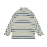 Main Story striped long-sleeve shirt with rolled neck and a brand logo on a white background