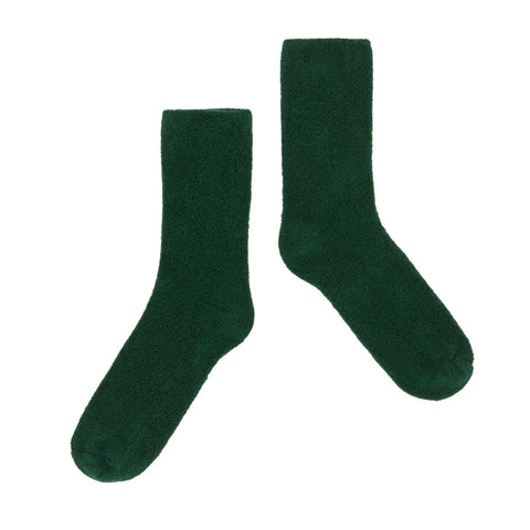 Pair of dark green  Main Story socks on a white background